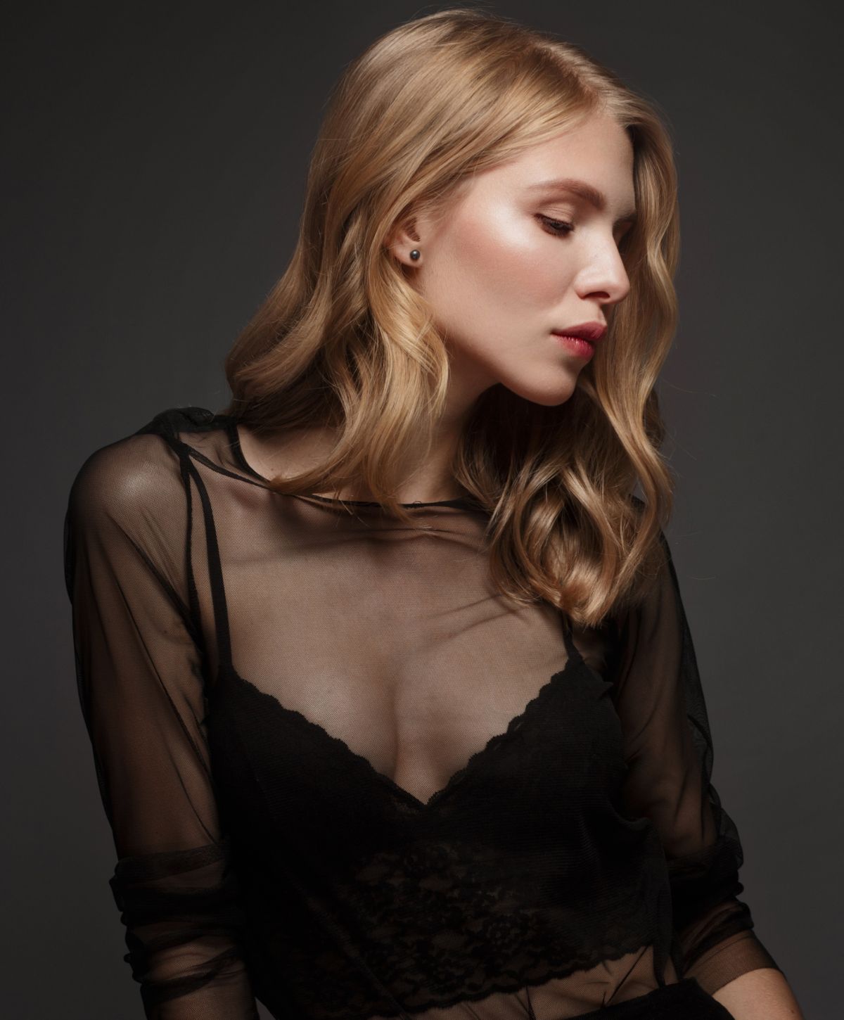 franklin skinvive model in sheer black blouse