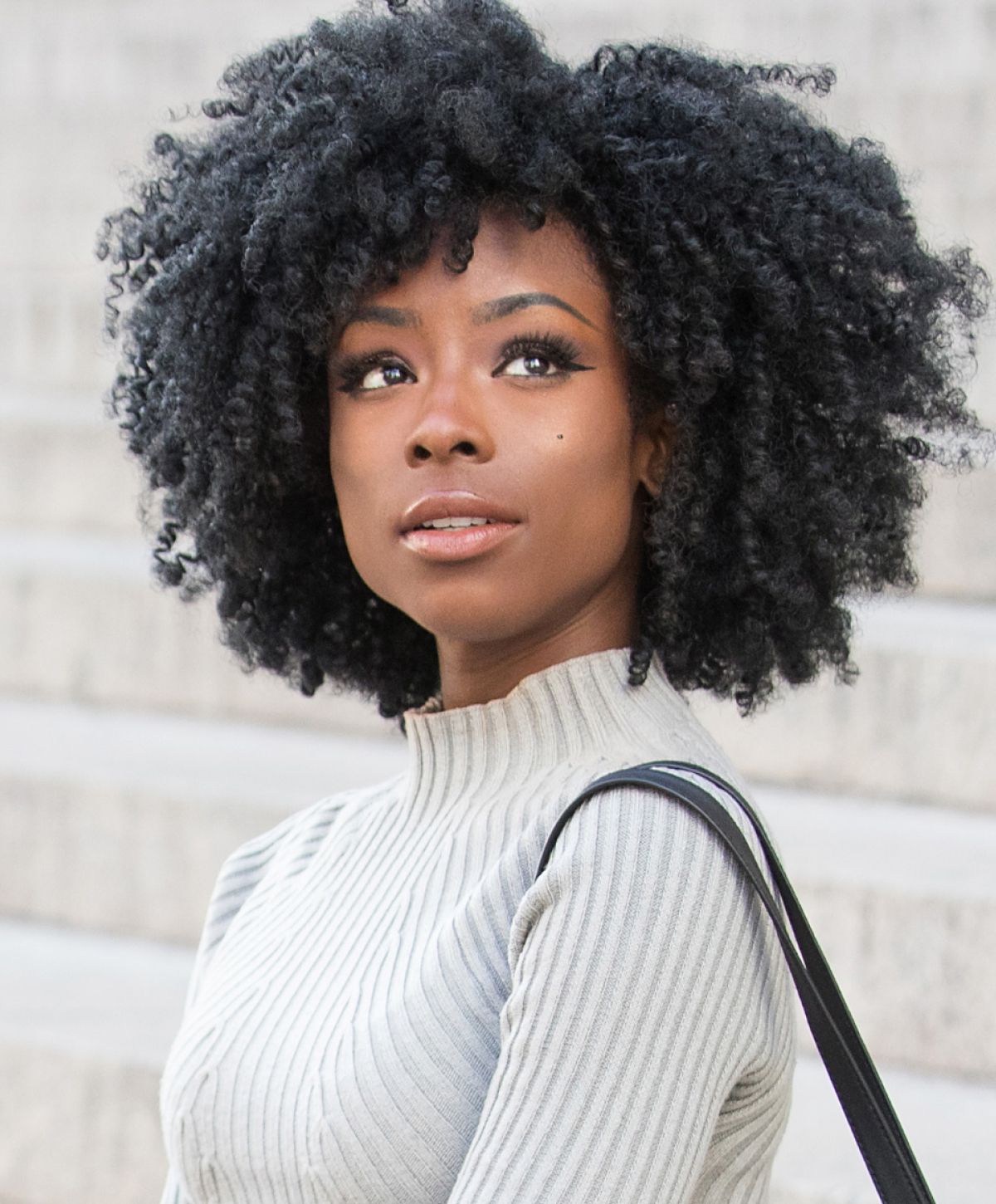 franklin hydrafacial model with black curly hair